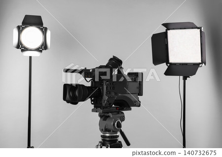Professional video camera and lighting equipment on white background 140732675
