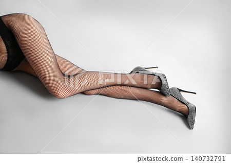 Woman wearing black tights and stylish shoes on light grey background, closeup of legs Woman wearing black tights and stylish shoes on light grey background, closeup of legs 140732791
