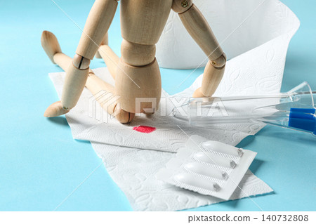 Composition with anoscope on light blue background. Hemorrhoid treatment Composition with anoscope on light blue background. Hemorrhoid treatment 140732808
