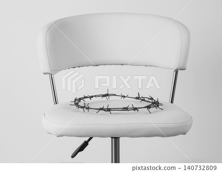 Chair with barbed wire on white background. Hemorrhoids concept 140732809