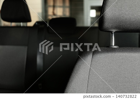 Car seat with grey upholstery, closeup view Car seat with grey upholstery, closeup view 140732822