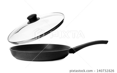 Empty modern frying pan with lid isolated on white Empty modern frying pan with lid isolated on white 140732826