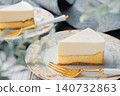 A two-layered cheesecake, one rare and one baked, with a stylish cafe-style presentation. 140732863