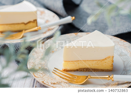 A two-layered cheesecake, one rare and one baked, with a stylish cafe-style presentation. A two-layered cheesecake, one rare and one baked, with a stylish cafe-style presentation. 140732863