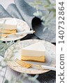 A two-layered cheesecake, one rare and one baked, with a stylish cafe-style presentation. 140732864