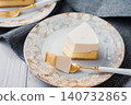 A two-layered cheesecake, one rare and one baked, with a stylish cafe-style presentation. 140732865