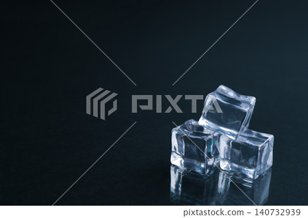 Crystal clear ice cubes on black background. Space for text Crystal clear ice cubes on black background. Space for text 140732939