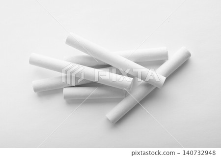 Pieces of chalk on white background, top view Pieces of chalk on white background, top view 140732948
