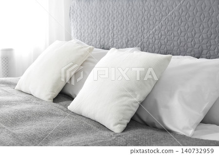 Bed with soft fluffy pillows at home Bed with soft fluffy pillows at home 140732959