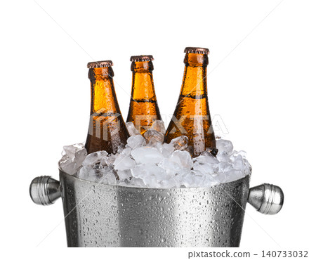Beer in metal bucket with ice isolated on white Beer in metal bucket with ice isolated on white 140733032