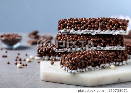 Delicious rice crispy treats on grey table, closeup Delicious rice crispy treats on grey table, closeup 140733071