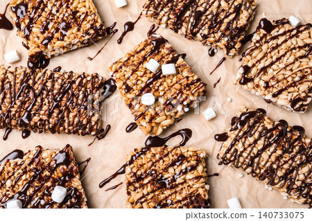 Delicious rice crispy treats on parchment paper, flat lay 140733075