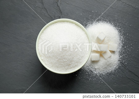 Flat lay composition with granulated sugar on dark table Flat lay composition with granulated sugar on dark table 140733101