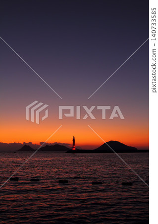 Seascape at sunshine. Lighthouse and sailings on the coast. Seaside town of Turgutreis and spectacular sunshine Seascape at sunshine. Lighthouse and sailings on the coast. Seaside town of Turgutreis and spectacular sunshine 140733585
