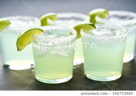 Refreshing cocktail Margarita with lime and salt, selective focus. Close up. Refreshing cocktail Margarita with lime and salt, selective focus. Close up. 140733884