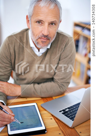 Portrait, laptop and businessman with tablet in office for statistics research on internet. Serious, computer and mature financial planner work on budget project with digital technology in workplace. Portrait, laptop and businessman with tablet in office for statistics research on internet. Serious, computer and mature financial planner work on budget project with digital technology in workplace. 140734308