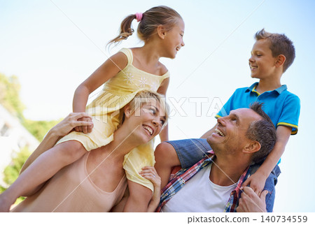 Smile, parents and carrying children in park, shoulders and quality time in nature. Love, fun and joyful with happy mother and father on holiday relax, spring and carefree with family on vacation Smile, parents and carrying children in park, shoulders and quality time in nature. Love, fun and joyful with happy mother and father on holiday relax, spring and carefree with family on vacation 140734559