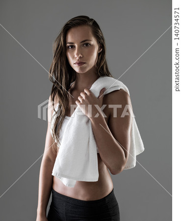 Woman, portrait and sweat towel for workout in studio for physical activity challenge, performance or grey background. Female person, endurance and gym fitness for wellness, training or mockup space Woman, portrait and sweat towel for workout in studio for physical activity challenge, performance or grey background. Female person, endurance and gym fitness for wellness, training or mockup space 140734571
