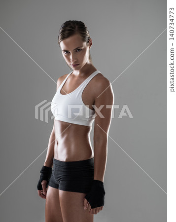 Woman, portrait and workout exercise for health in studio for performance, grey background or fitness. Female person, face and physical practice for weight loss or sport activity, training or mockup Woman, portrait and workout exercise for health in studio for performance, grey background or fitness. Female person, face and physical practice for weight loss or sport activity, training or mockup 140734773