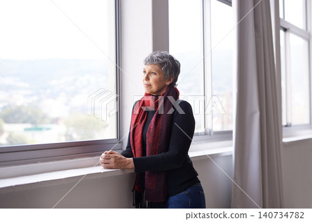 Window, thinking and senior woman with sunshine, ideas or retirement with nostalgia and memory. Old person, mature lady or pensioner with view or peace with wonder or thoughts with decision or choice 140734782