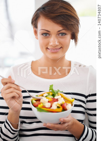 Woman, salad and healthy food in portrait for diet with detox, breakfast and lunch at home. Young person eating vegetables, lettuce and green fruit or vegan meal in bowl for nutrition and wellness Woman, salad and healthy food in portrait for diet with detox, breakfast and lunch at home. Young person eating vegetables, lettuce and green fruit or vegan meal in bowl for nutrition and wellness 140734807