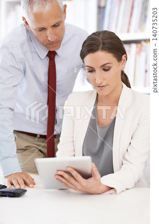 Business people, tablet and teamwork for website brainstorming or startup as financial advisor, consultant or collaboration. Man, woman and online internet for accounting deal, investment or planning 140735203
