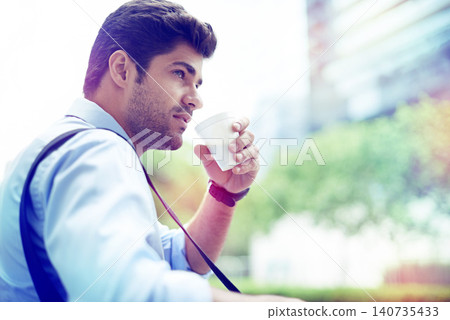 Professional, businessman and coffee in city for thinking, planning and thoughts for startup project. Outdoors, cappuccino and male person drinking expresso for caffeine or energy in morning Professional, businessman and coffee in city for thinking, planning and thoughts for startup project. Outdoors, cappuccino and male person drinking expresso for caffeine or energy in morning 140735433
