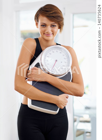 Fitness, portrait or happy woman in home with scale for body training or gym workout to lose weight. Wellness, monitor or confident female sports athlete in health club for exercise progress results Fitness, portrait or happy woman in home with scale for body training or gym workout to lose weight. Wellness, monitor or confident female sports athlete in health club for exercise progress results 140735624