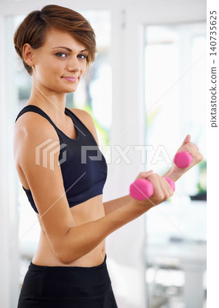 Home workout, portrait or woman with fitness, dumbbells or power for strength training, gym studio or exercise. Athlete, sports or body of female person with weights, energy or strong arms for health Home workout, portrait or woman with fitness, dumbbells or power for strength training, gym studio or exercise. Athlete, sports or body of female person with weights, energy or strong arms for health 140735625