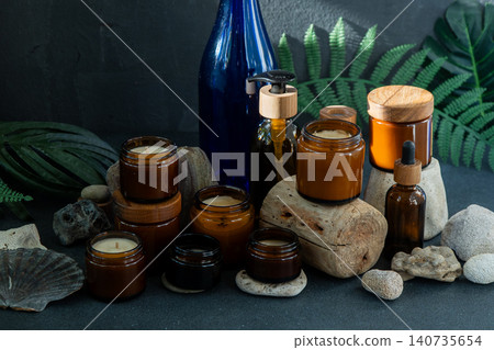 Amber Candles Glass Jars and Bottles Natural still life Amber Candles Glass Jars and Bottles Natural still life 140735654