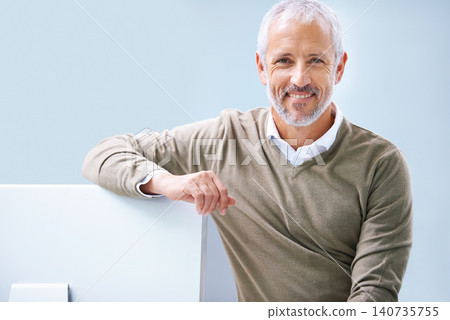 Mature, businessman and portrait at computer for as boss for tech startup, entrepreneurship or small business. Male person, face and company development or employee, employment or blue background 140735755