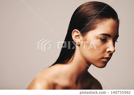 Woman, beauty and eyeshadow for skincare and makeup on face for cosmetic and vibrant. Model, beautiful and attractive with lipstick for shine and glow with shimmer and glitter in studio on mockup Woman, beauty and eyeshadow for skincare and makeup on face for cosmetic and vibrant. Model, beautiful and attractive with lipstick for shine and glow with shimmer and glitter in studio on mockup 140735992