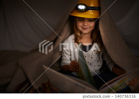 Happy child, bedroom and reading book at night with flashlight for learning, education and imagination. Girl or kid in blanket at home for story, creative and fantasy with adventure alone in dark Happy child, bedroom and reading book at night with flashlight for learning, education and imagination. Girl or kid in blanket at home for story, creative and fantasy with adventure alone in dark 140736316