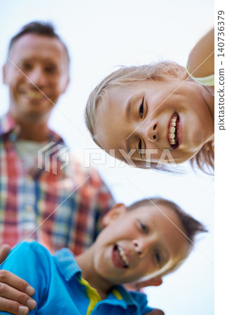 Portrait, low angle and family with summer happiness and bonding together with weekend break. Face, parents and mother with father and children with fun and sunshine with kids and joyful with smile 140736379