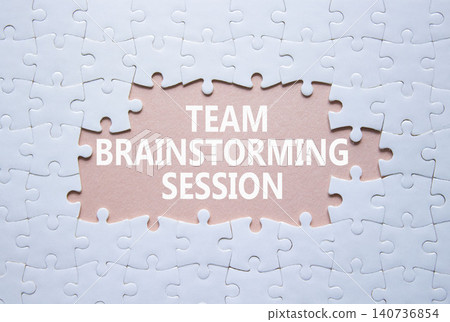 Team Brainstorming Session symbol. White puzzle with words Team Brainstorming Session. Beautiful pink background. Business concept. Copy space. Team Brainstorming Session symbol. White puzzle with words Team Brainstorming Session. Beautiful pink background. Business concept. Copy space. 140736854