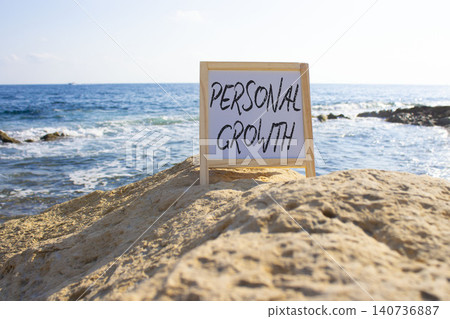 Personal Growth symbol. White blackboard with Concept words Personal Growth. Beautiful sea background. Business and Personal Growth concept. Copy space. Personal Growth symbol. White blackboard with Concept words Personal Growth. Beautiful sea background. Business and Personal Growth concept. Copy space. 140736887