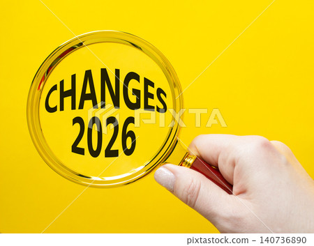 Changes 2026 symbol. Magnifying Glass with words Changes 2026. Beautiful yellow background. Businessman hand. Business and Changes 2026 concept. Copy space. Changes 2026 symbol. Magnifying Glass with words Changes 2026. Beautiful yellow background. Businessman hand. Business and Changes 2026 concept. Copy space. 140736890