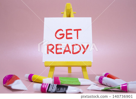 Get ready symbol. Wooden blocks with words Get ready. Beautiful pink background with paints and easel. Business and Get ready concept. Copy space. Get ready symbol. Wooden blocks with words Get ready. Beautiful pink background with paints and easel. Business and Get ready concept. Copy space. 140736901
