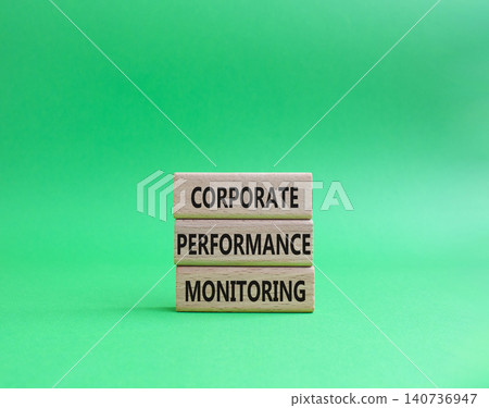 Corporate performance monitoring symbol. Concept word Corporate performance monitoring on wooden blocks. Beautiful green background. Business and Corporate performance monitoring. Copy space 140736947