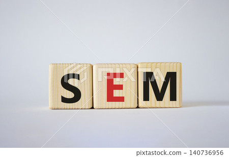 SEM - Search Engine Marketing symbol. Wooden cubes with words SEM. Beautiful white background. Business and SEM concept. Copy space. 140736956