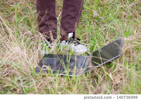 image of male feet and laptop. 140736999