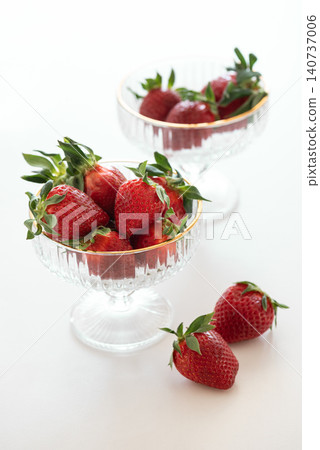 Fresh strawberries in elegant crystal dessert bowls 140737006