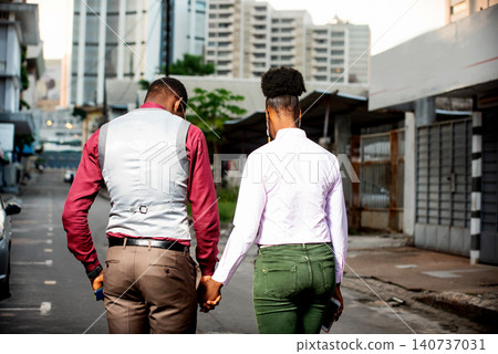 beautiful young couple walking on the street beautiful young couple walking on the street 140737031