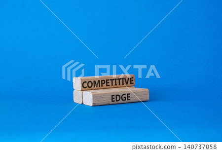 Competitive edge symbol. Concept word Competitive edge on wooden blocks. Beautiful blue background. Business and Competitive edge concept. Copy space Competitive edge symbol. Concept word Competitive edge on wooden blocks. Beautiful blue background. Business and Competitive edge concept. Copy space 140737058