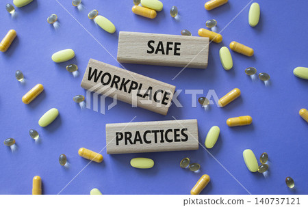 Safe Workplace Practices symbol. Concept words Safe Workplace Practices on wooden blocks. Beautiful purple background with pills. Healthcare and Safe Workplace Practices concept. Copy space. Safe Workplace Practices symbol. Concept words Safe Workplace Practices on wooden blocks. Beautiful purple background with pills. Healthcare and Safe Workplace Practices concept. Copy space. 140737121