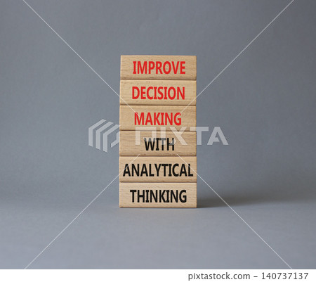 Improve decision making with analytical thinking symbol. Concept words improve decision making with analytical thinking on wooden blocks. Beautiful grey background. Business concept. Copy space. Improve decision making with analytical thinking symbol. Concept words improve decision making with analytical thinking on wooden blocks. Beautiful grey background. Business concept. Copy space. 140737137