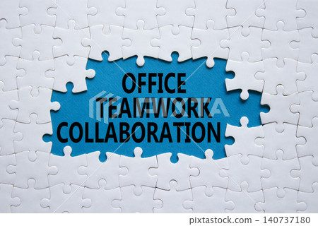 Office Teamwork Collaboration symbol. White puzzle with words Office Teamwork Collaboration. Beautiful blue background. Business concept. Copy space. Office Teamwork Collaboration symbol. White puzzle with words Office Teamwork Collaboration. Beautiful blue background. Business concept. Copy space. 140737180