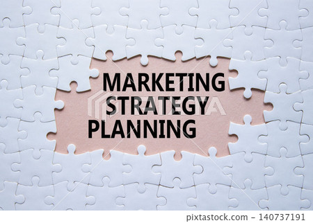 Marketing Strategy Planning symbol. White puzzle with words Marketing Strategy Planning. Beautiful pink background. Business concept. Copy space. 140737191