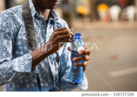 handsome young man tourism drinking mineral water handsome young man tourism drinking mineral water 140737199