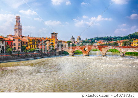 Gorgeous View of Verona cityscape view on the riverside with historical buildings ,bridges and towers Gorgeous View of Verona cityscape view on the riverside with historical buildings ,bridges and towers 140737355